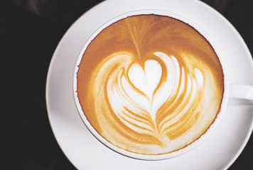 heart symbol in coffee cup