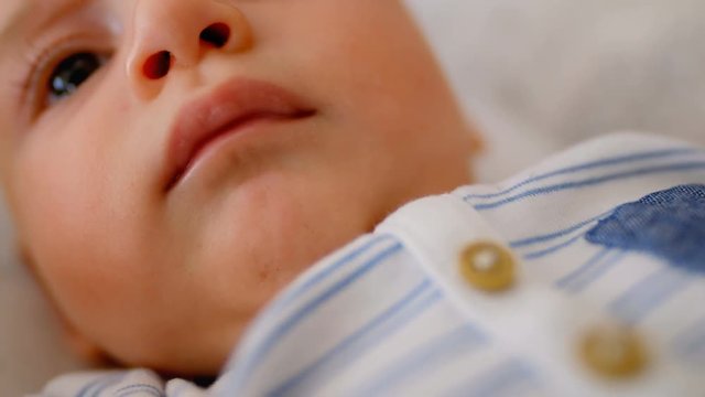 Cute little baby lying in the crib 