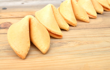 Fortune cookie isolated on wood board .