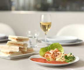 fish and shrips appetizer with a glass of white wine