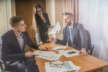 three businessmen at the meeting to communicate