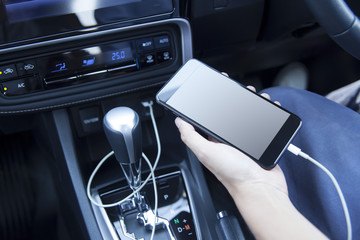 Smartphone in a car use for Navigate or GPS. Driving a car with Smartphone