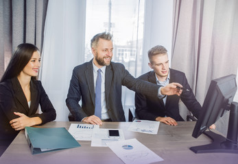 three businessmen at the meeting to communicate