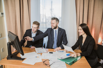 three businessmen at the meeting to communicate