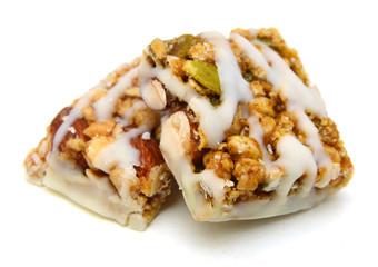 Honey bars with peanuts on white background