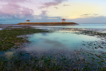 Gazebo in the middle on sea in low tide during sunset or sunrise