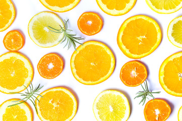 Sliced oranges and lemon with rosemary pattern