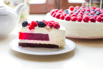 Home mousse cake with cottage cheese and jello with raspberries and blackberries. The concept of proper nutrition, weight loss, health holidays