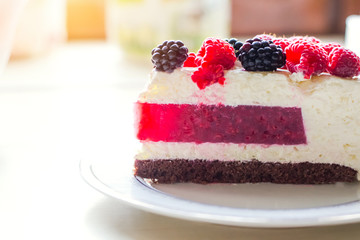 Home mousse cake with cottage cheese and jello with raspberries and blackberries. The concept of proper nutrition, weight loss, health holidays