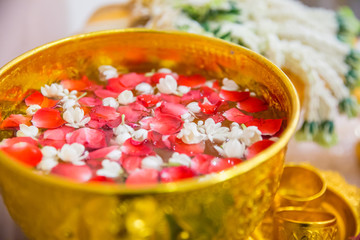 holy water with aroma rose and jasmine flower used in Thai wedding ceremony