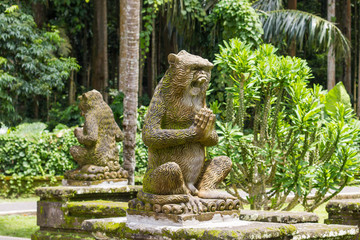 Sculpture of monkeys in tropical garden of Bali, Indonesia