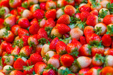 Fresh strawberries in the crate wood at the market Bangkok Thailand