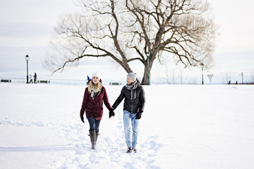 Fototapeta na wymiar Young couple outside in winter