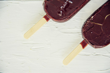 Ice cream coated with chocolate glaze, top view