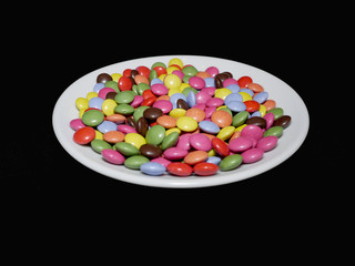 sweet candies on plate