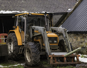 Fototapeta na wymiar Working Tractor in Barn