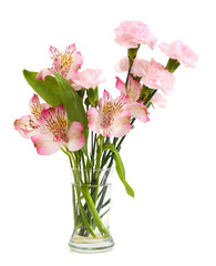 Bouquet of pink carnations and lily in vase isolated over white