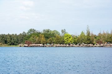 A line of rafts at Huay Tung Tao lake at Chiangmai Thailand with tree and blue sky background