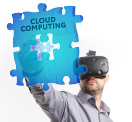 The concept of business, technology, the Internet and the network. A young entrepreneur working on a virtual screen of the future and sees the inscription: Cloud computing