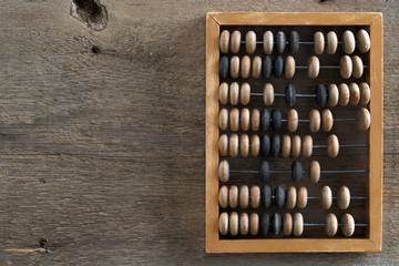 old abacus on a wooden table