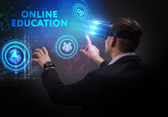 Business, Technology, Internet and network concept. Young businessman working on a virtual screen of the future and sees the inscription: Online education
