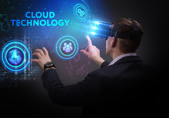 Business, Technology, Internet and network concept. Young businessman working on a virtual screen of the future and sees the inscription: Cloud technology