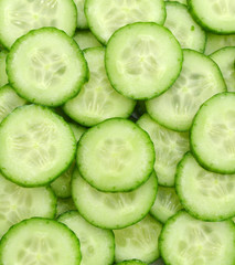 Fresh Cucumber and slices  background.