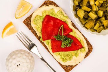 Red Peppers With Avocado and Hummus On Rye Open Face Sandwich