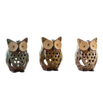 Three cute ceramic owls. isolated white background