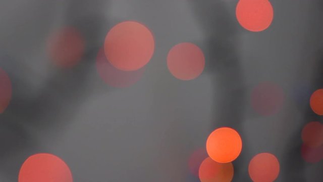 Beautiful Blurred Lights of Red And Orange Rounds. Bokeh Particles With Gray Backdrop. Abstract Motion Background

