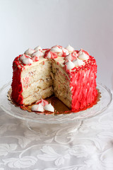 Red homemade cake decorated by hearts.