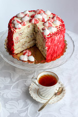 Red homemade cake decorated by hearts.