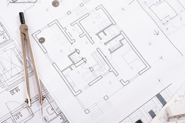 Architectural project, engineering tools on table.