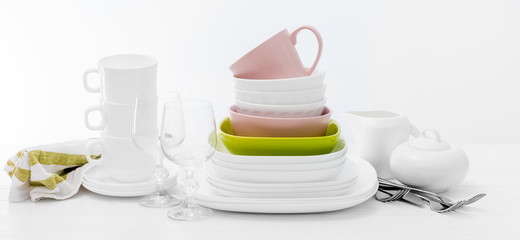 Pile of colourful square dishes and cups