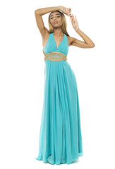 Fototapeta premium Full body portrait of a beautiful young african woman in a turquoise dress