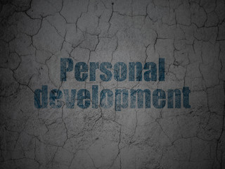 Studying concept: Blue Personal Development on grunge textured concrete wall background