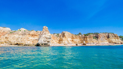 Limestone formations on the coastline and beach of Algarve, Benagil, Portugal