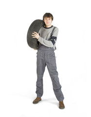 A young brunet foreman in working grey uniform with black wheel.