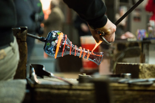 Artisan Making Glass Vases And Sculptures In Murano