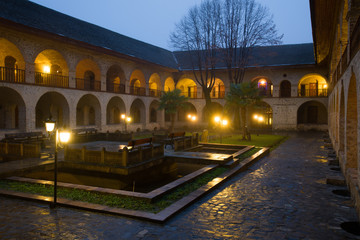 The courtyard of the ancient upper Caravanserai in the January twilight. Sheki, Azerbaijan