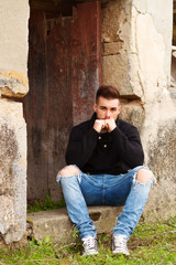 Obraz premium Attractive guy in a old house