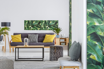 Spacious living room with poster