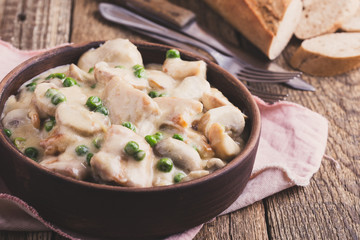 Chicken and mushroom stew in ceramic bowl