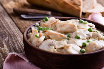 Chicken and mushroom stew in ceramic bowl