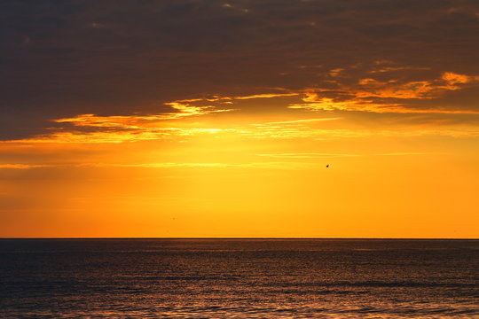 Beautiful orange-lead sunrise over the Black sea