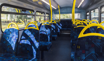 Empty top floor of a London double-decker bus