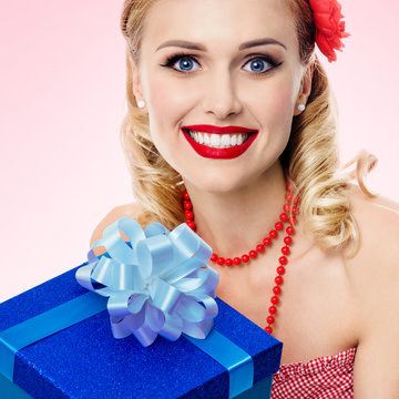 woman in pin-up style clothing with gift box