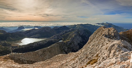 Panoramic aerial view of mountains and lake landscape with a sea of clouds in Majorca, Serra de Tramuntana Unesco World Heritage in Balearic Islands