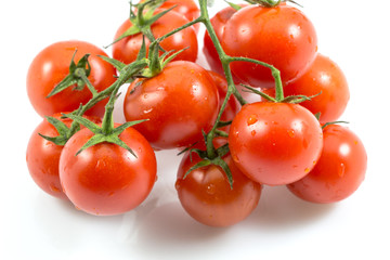 Red tomatoes isolated on white with a clipping path background.