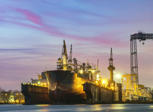 merchant ship in the dry dock of the repair yard